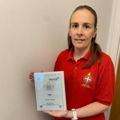 A member of Girls Brigade poses with an Autism NI Impact Award